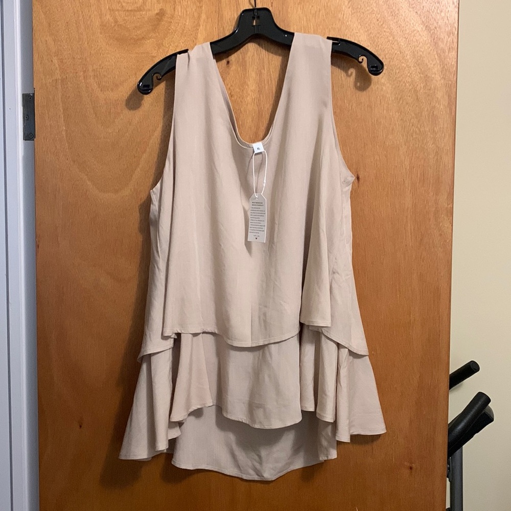Summer Blouse Size XL more like L.  Love it but too tight